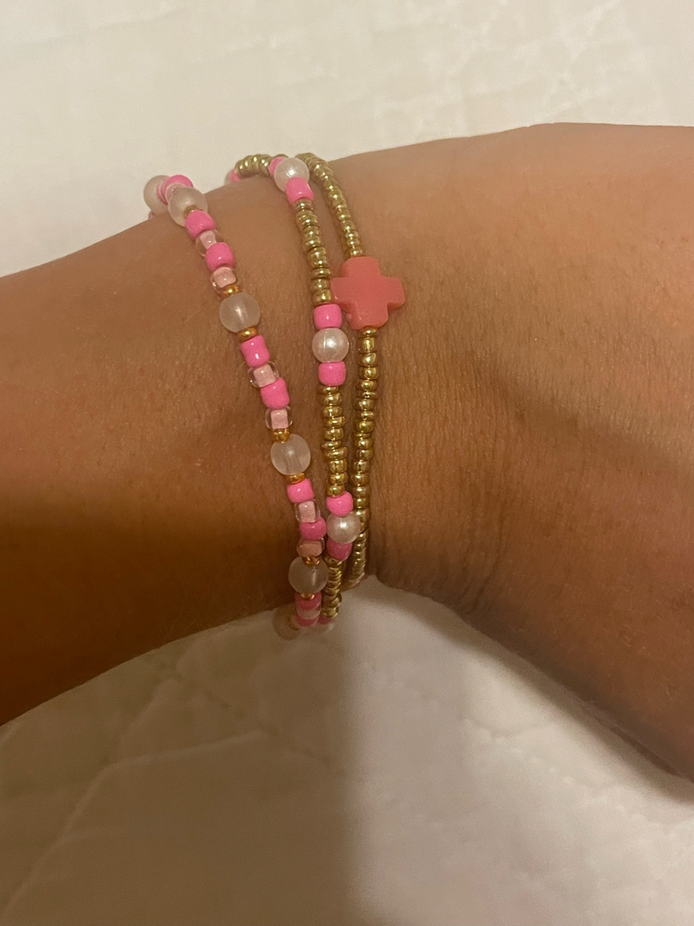 SET OF 3 gold, pearl, pink bracelet with a enewton cross.